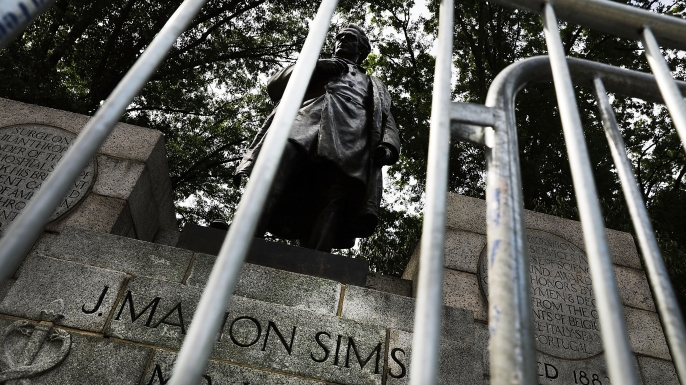 A statue of J. Marion Sims. Following the violence in Charlottesville, Virginia, many politicians, activists and citizens are calling for monuments dedicated to Confederate-era and other controversial figures to be taken down. (Credit: Spencer Platt/Getty Images)