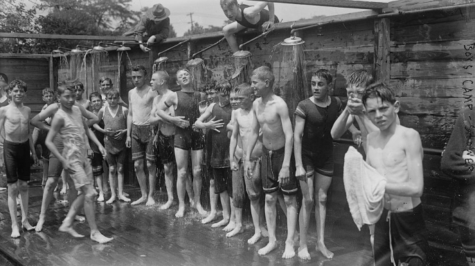Boys taking a shower at the summer military training camp for boys at Peekskill, New York, 1917. (Credit: The Library of Congress)