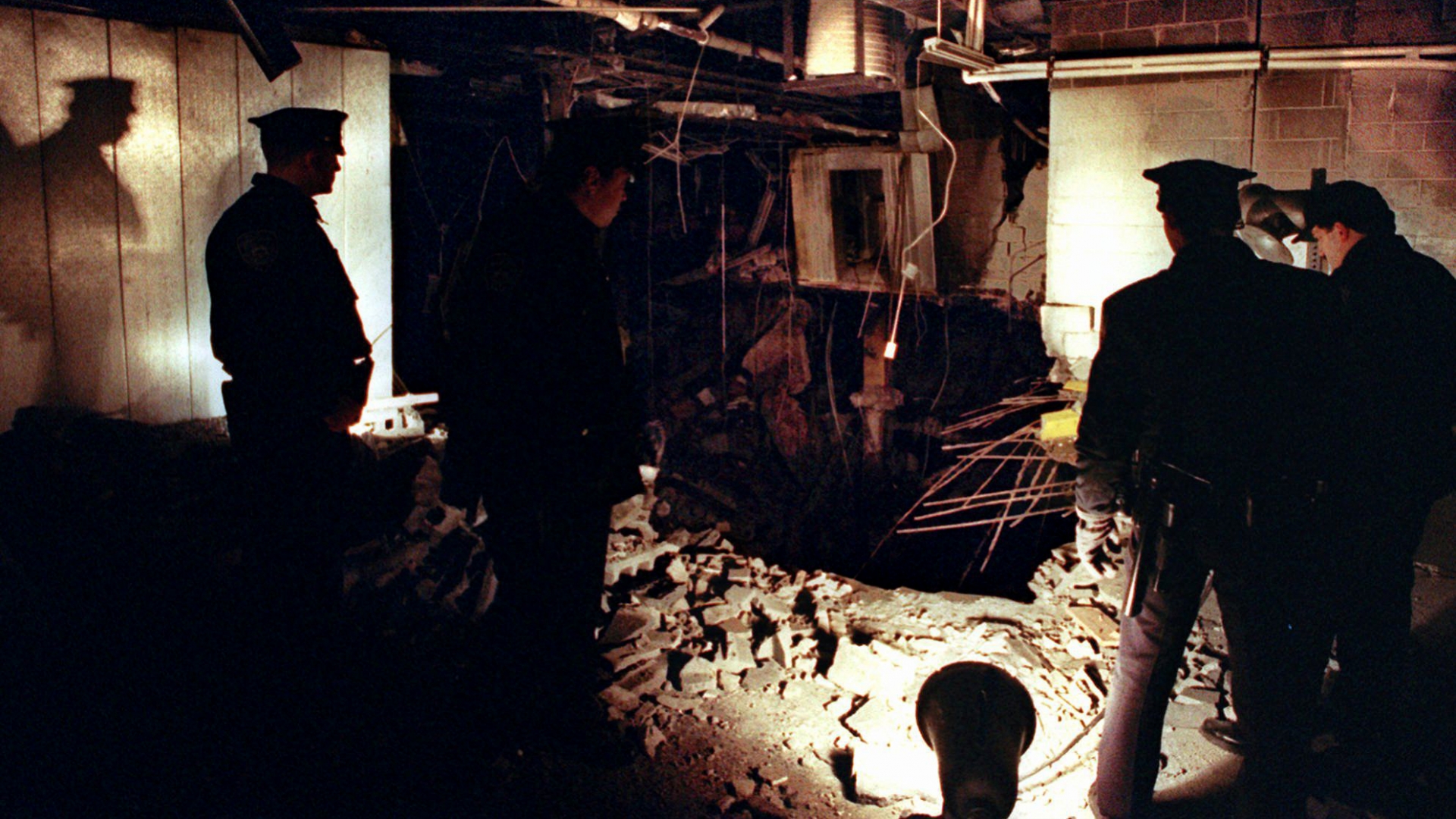 New York City Police officers view the damage caused by a truck bomb that exploded in the garage of New York's World Trade Center, 1993, that killed six people and injured more than 1,000. (Credit: Richard Drew/AP/REX/Shutterstock)