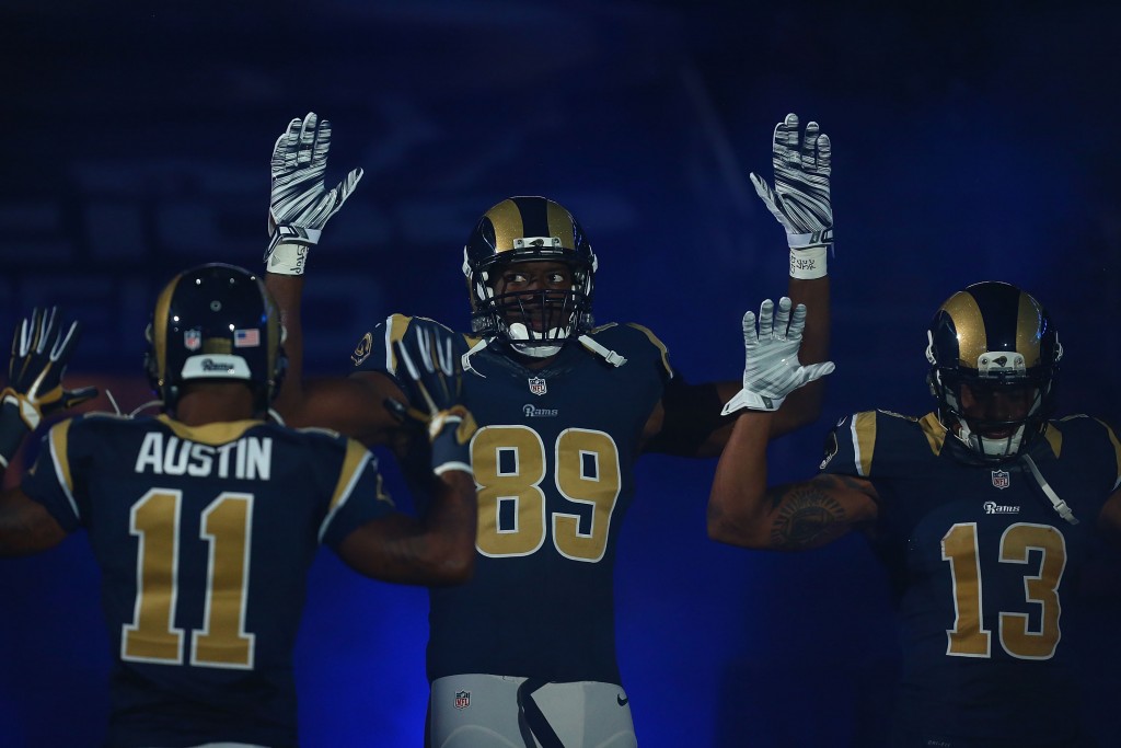 The St. Louis Rams pay homage to Michael Brown by holding their hands up during their pre-game introduction against the Oakland Raiders, November 30, 2014. (Credit: Dilip Vishwanat/Getty Images)