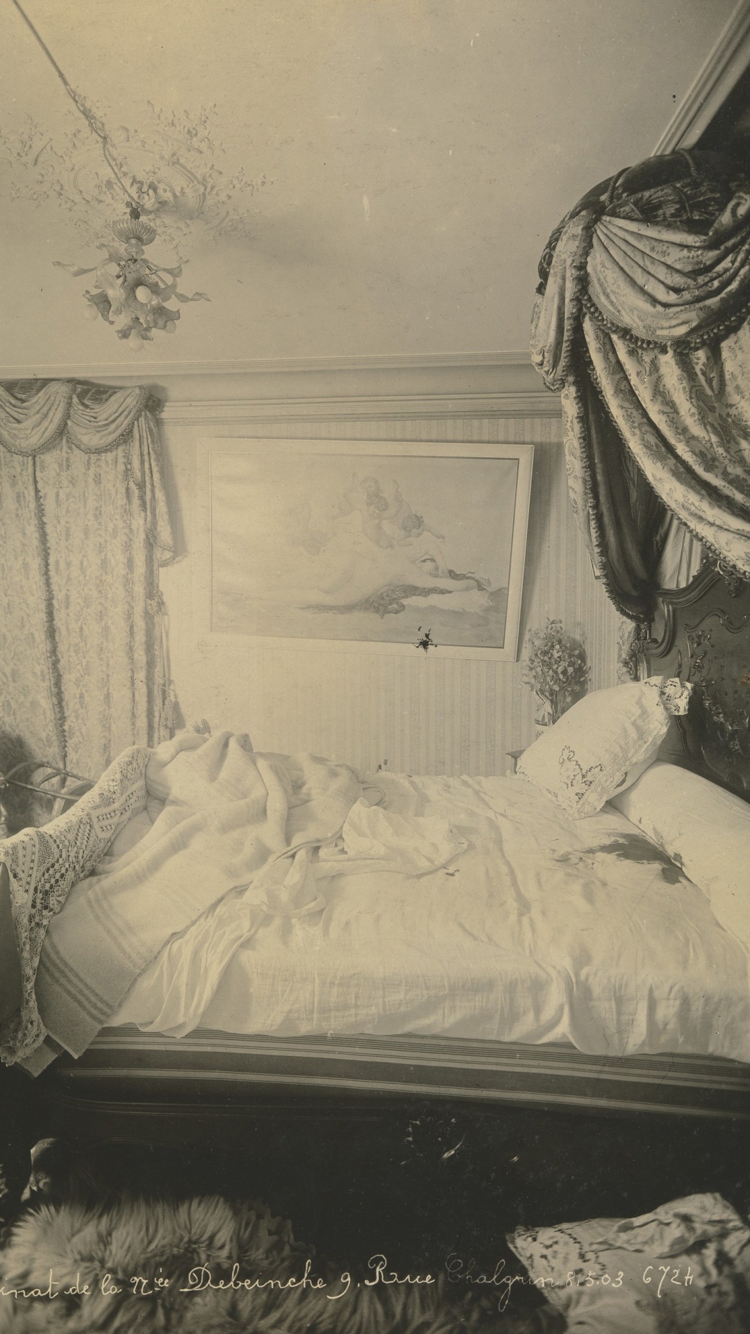 Bedroom of Madame Debeinche, murdered May 5, 1903. From this angle, the scene looks unsettling, with the picture askew and the dark stain on the bed. (Credit: The Metropolitan Museum of Art)