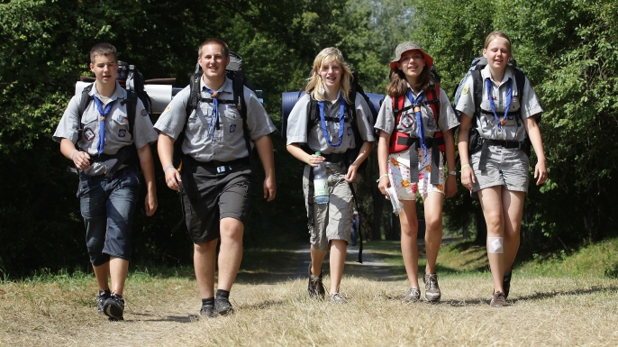 Scouts hiking through a woodland on August 1, 2010 in Almke near Wolfsburg, Germany. (Credit: Andreas Rentz/Getty Images)