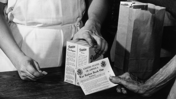 In an effort to ration sugar, coupons from the War Ration Books assured a just distribution of the nation's sugar supply to all, July 1942. (Credit: Anthony Potter Collection/Getty Images)