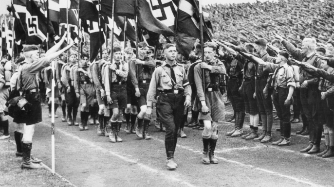 Germany's young fascists receive famous salute during a mass march in Berlin, 1934. (Credit: Bettmann/Getty Images)