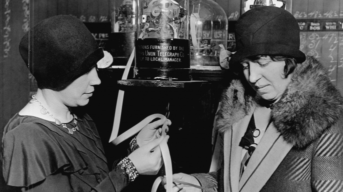 Two women read ticker-tape in a stock broker's office in St. Paul, Minnesota, 1929. (Credit: Minnesota Historical Society/CORBIS/Corbis via Getty Images)