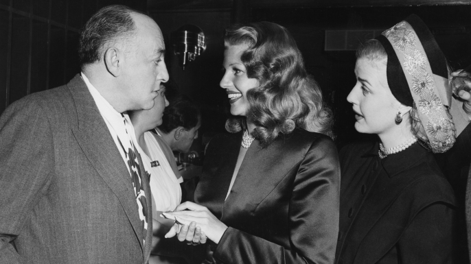 Harry Cohn with Rita Hayworth and Anita Louise, 1946. (Credit: Columbia/Kobal/REX/Shutterstock)
