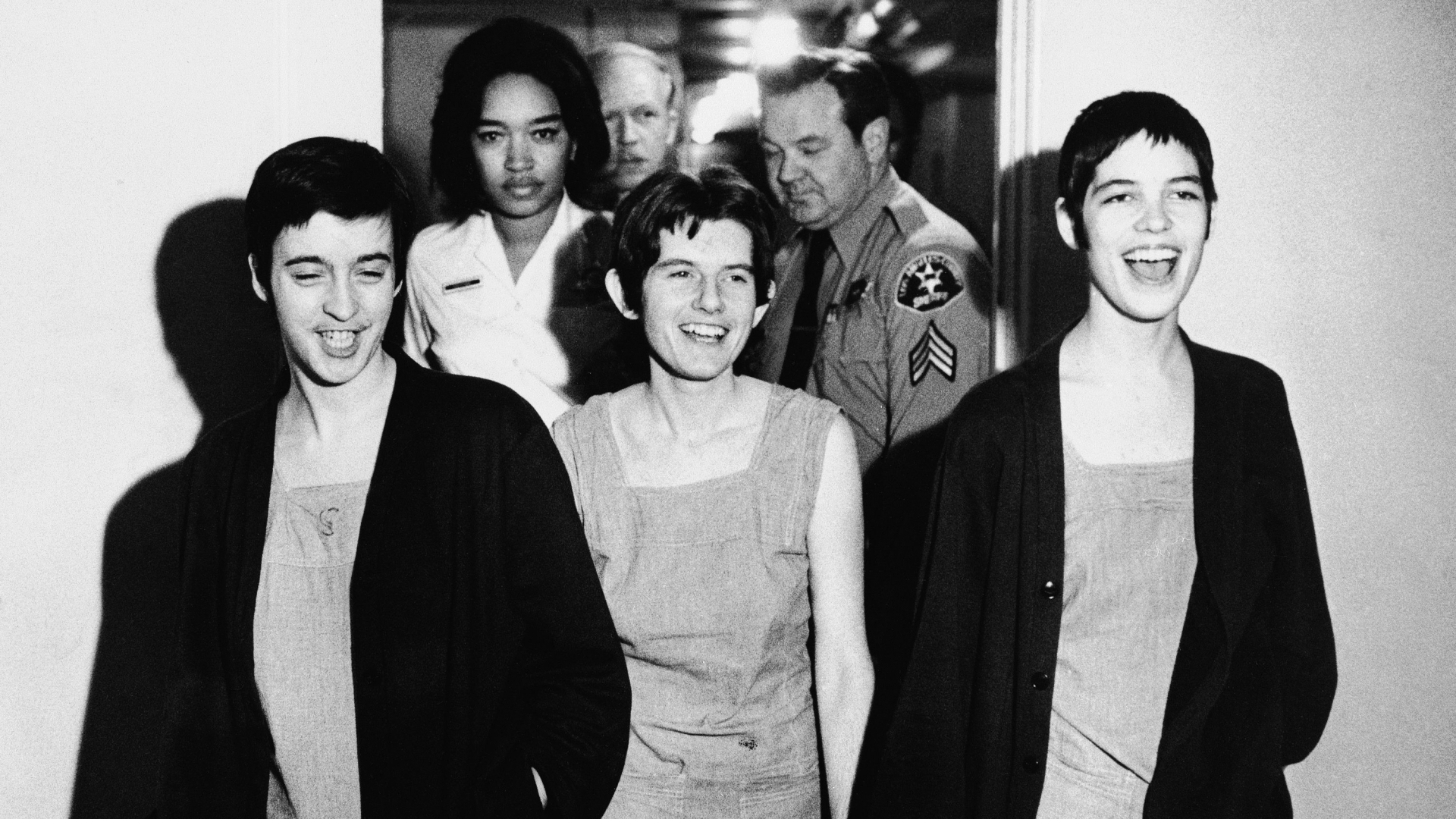 Susan Atkins, Patricia Krenwinkel and Leslie Van Houten, laughing as they walk to court for their sentencing in the Sharon Tate murder case, March 29, 1971. They angrily shouted at the judge when they were in the courtroom and were ejected, along with Charles Manson, before the jury sentenced them to death. (Credit: AP Photo)