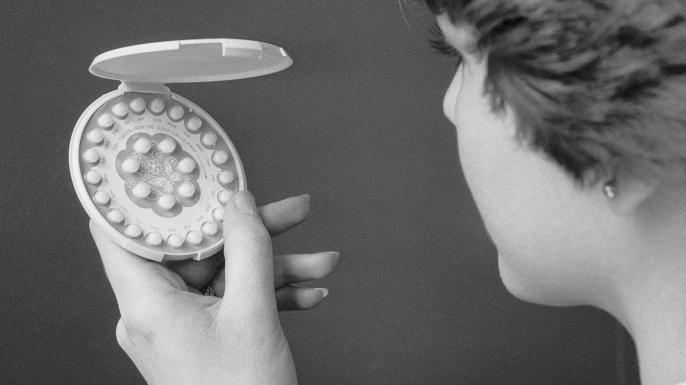 Woman holding her birth control pills, 1976. (Credit: Bettmann/Getty Images)
