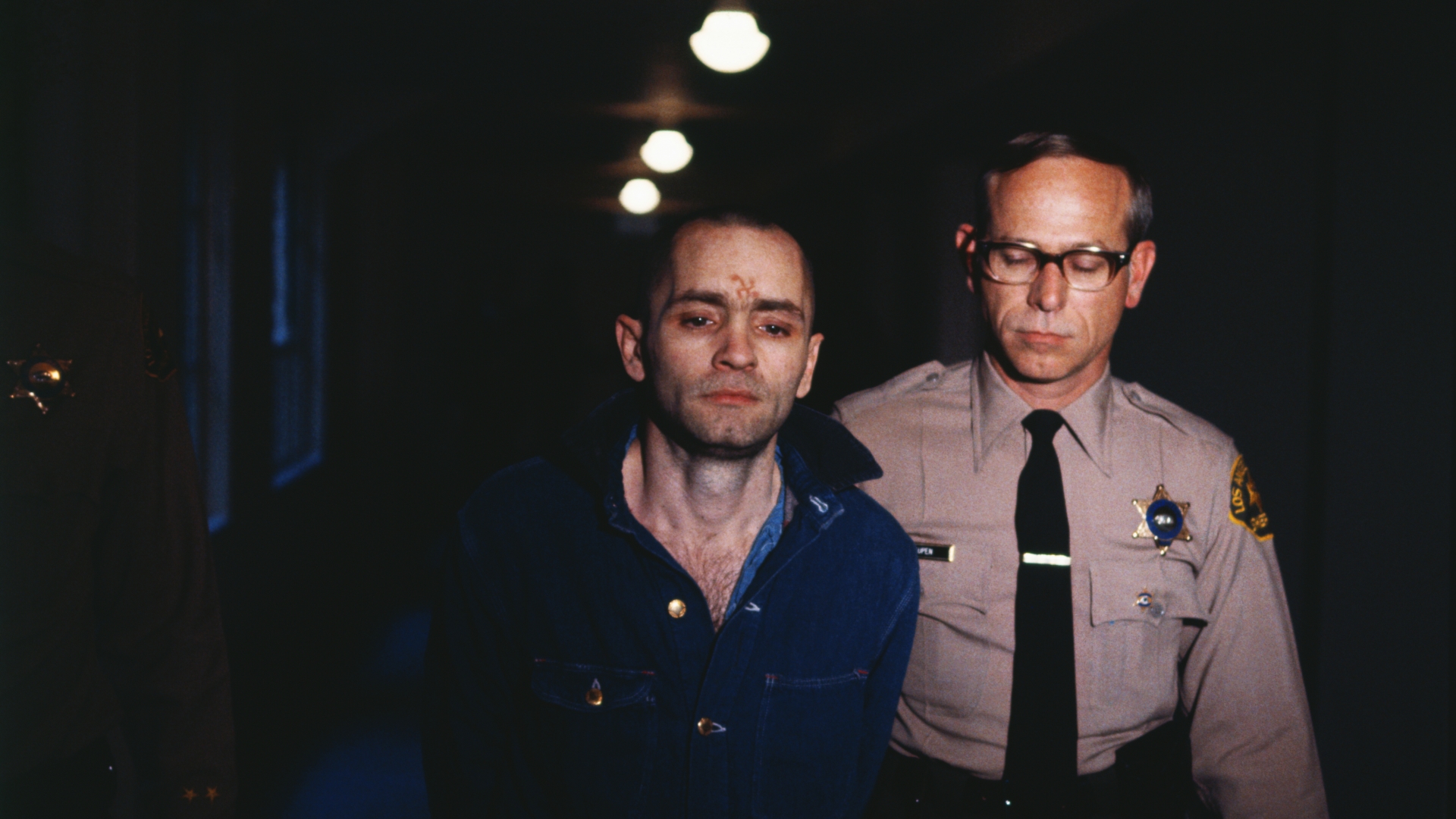 Charles Manson being led back into the courtroom to hear the penalty he and this three female followers must pay for the Tate-LaBianca murders of August 1969. (Credit: Bettmann Archive/Getty Images)