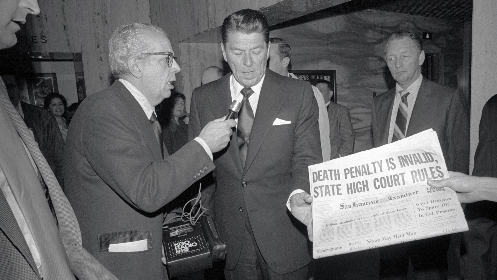Ronald Reagan, then California's governor who was opposed to the abolition of the death penalty, being interviewed after looking at newspaper account of the State Supreme Court decision that the death penalty is unconstitutional, 1972. (Credit: Bettmann Archive/Getty Images)
