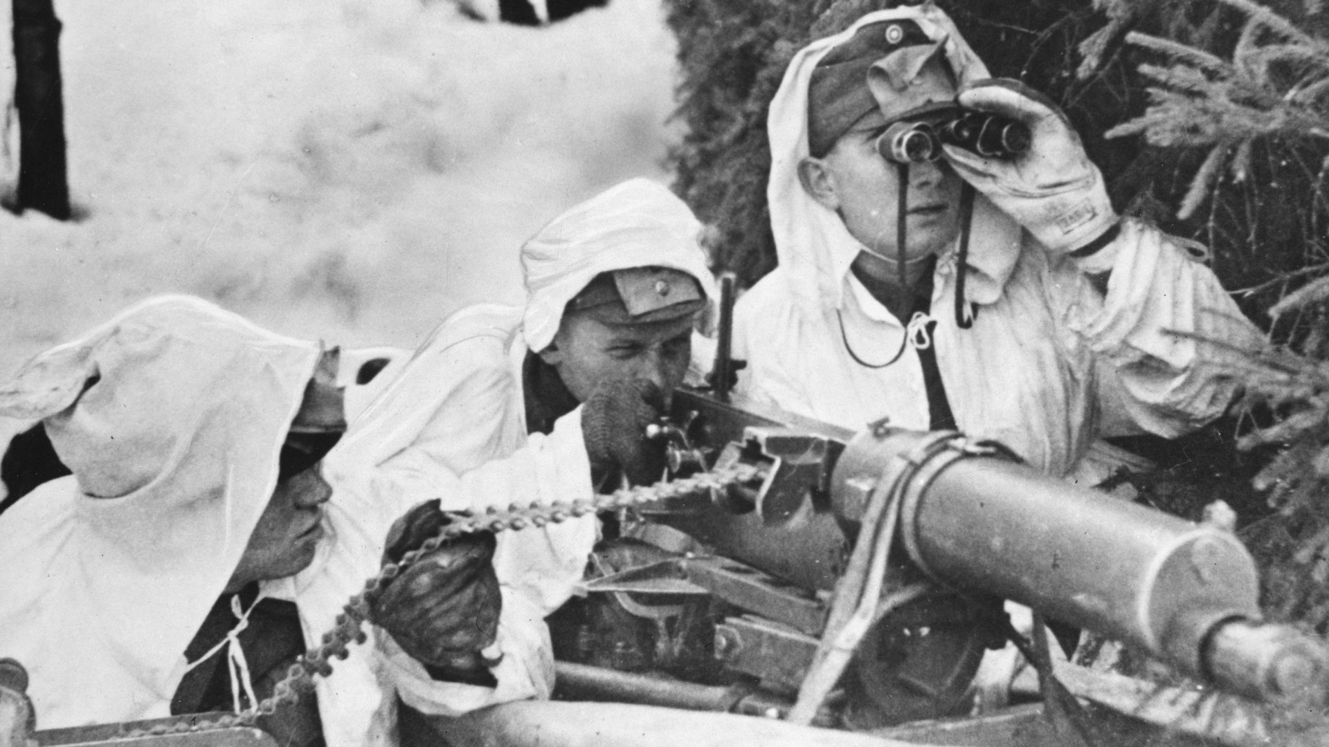 A Finnish machine-gun crew, wearing white to blend with the background of snow, in action against Russian troops during the Winter War. (Credit: Hulton-Deutsch Collection/CORBIS/Corbis via Getty Images)