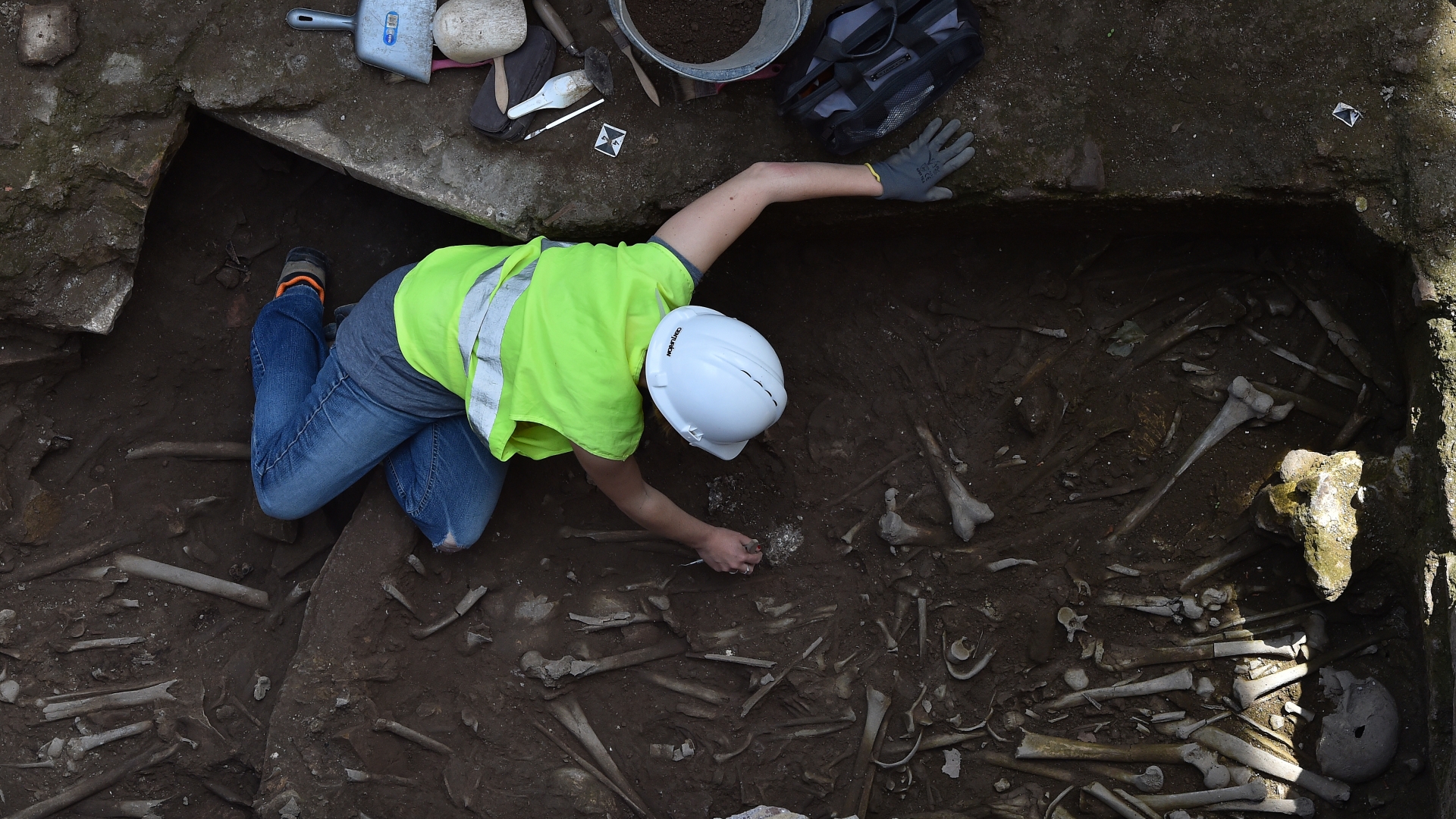 Archaeologists found a collective grave, where they have so far discovered 13 adult skeletons along with a bronze coin and a bronze bracelet. Officials hope to incorporate the discovery into the new metro station, which is scheduled to open in 2020. (Credit: Eric Vandeville/Sipa USA/AP Photo)