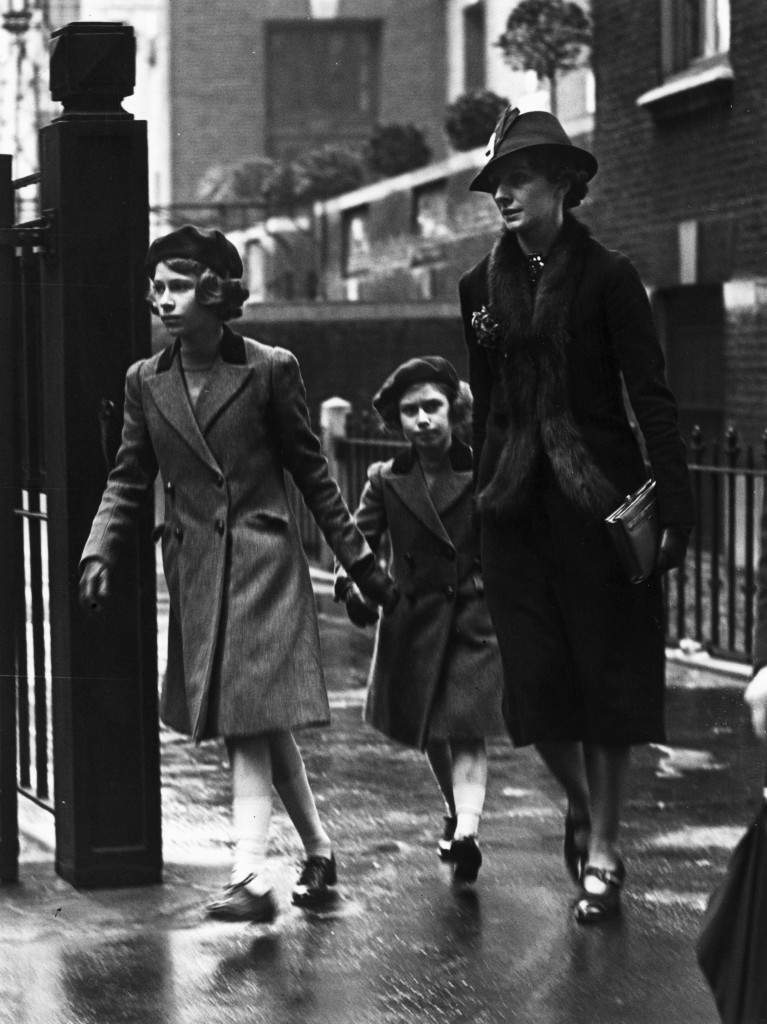Princess Elizabeth and her sister Princess Margaret accompanied by Miss Marion Crawford leaving the headquarters of the YWCA (Young Women's Christian Association) in London, May 1939. (Credit: Stephenson/Topical Press Agency/Getty Images)