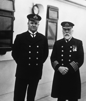 Purser Hugh Walter McElroy and Captain Edward J. Smith aboard the Titanic during the run from Southampton to Queenstown, England. The man who took the photograph, F.M. Browne, got off at Queenstown, three days before the ship hit an iceberg and sank. (Credit: Ralph White/Corbis via Getty Images)