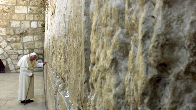 On March 26, 2000, Pope John Paul II visited the Western Wall in the Old City of Jerusalem asking for Christian forgiveness. (Credit: Jerome Delay/AP Photo)