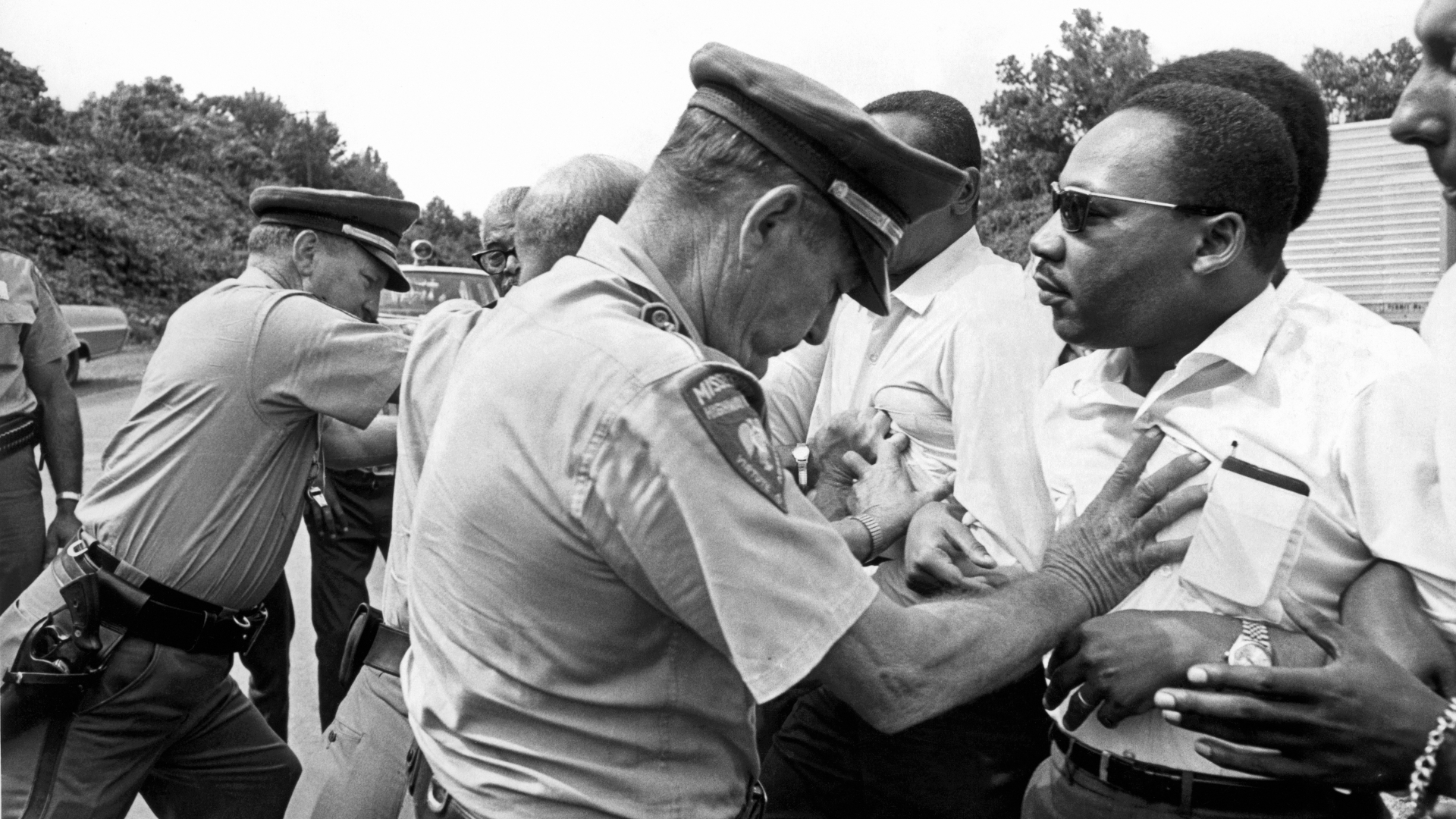 Dr. Martin Luther King being shoved back by Mississippi patrolmen during the 220 mile 'March Against Fear' from Memphis, Tennessee to Jackson, Mississippi, June 8, 1966. (Credit: Underwood Archives/Getty Images)