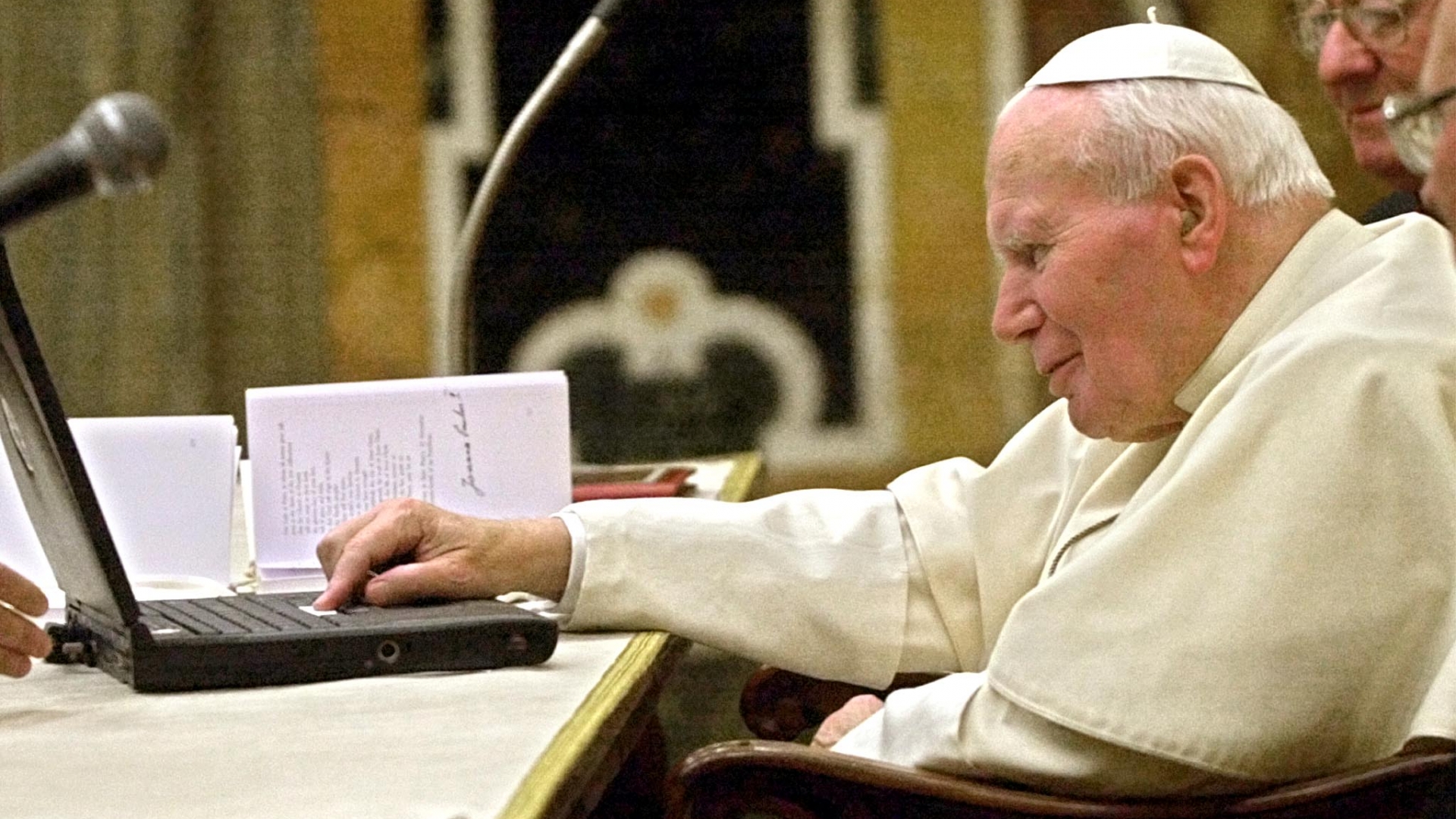 Pope John Paul II sending an e-mail at the Vatican, in his first message sent to the world directly over the Internet, apologizing to victims of sexual abuse by priests and other clergy, including nuns, in the developing world. (Credit: Massimo Sambucetti/AFP/Getty Images)