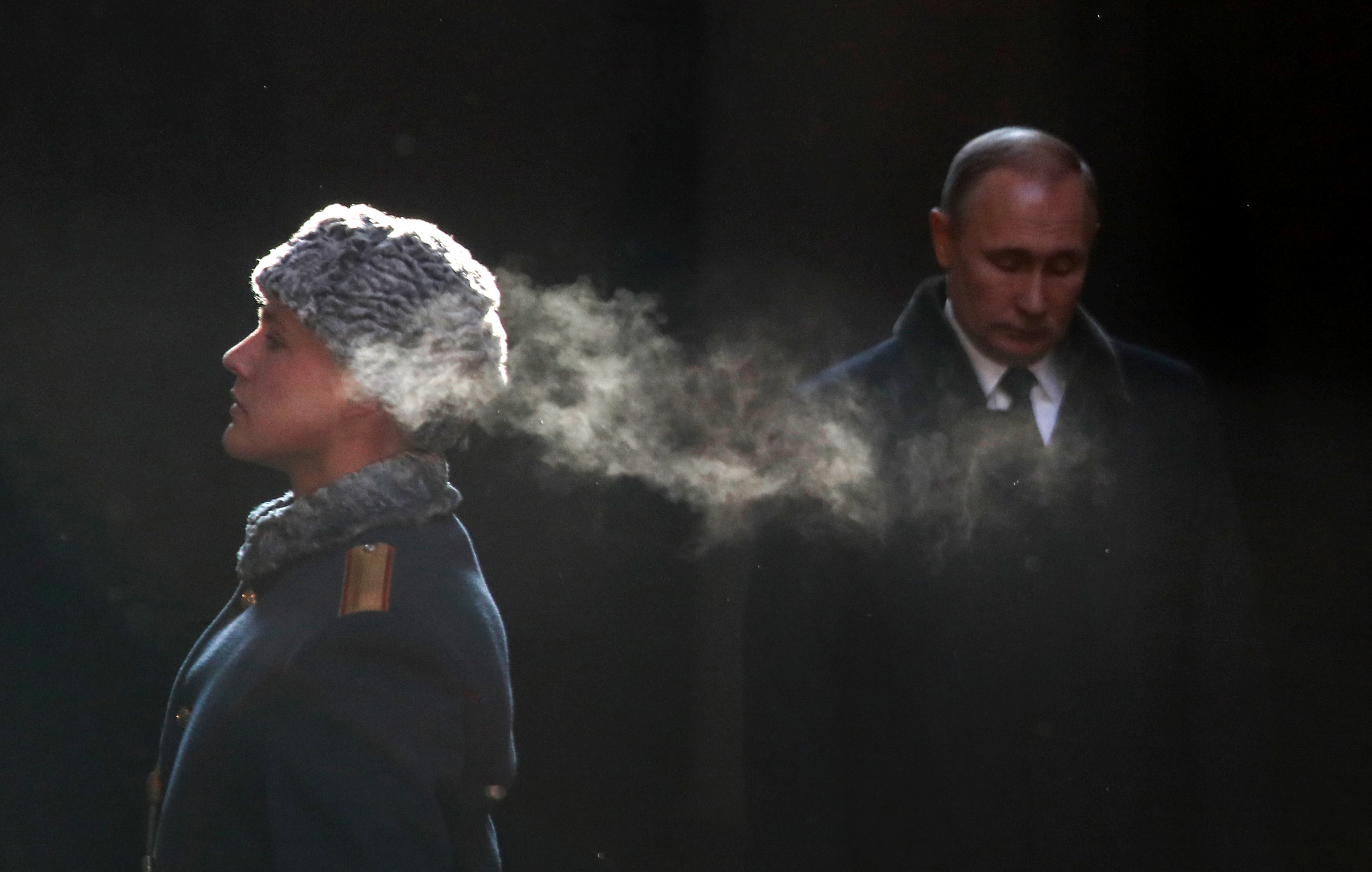 Vladimir Putin attending a wreath-laying ceremony in February 2018 at the eternal flame of the Mamayev Kurgan memorial complex in the city of Volgograd (formerly Stalingrad), during an event to commemorate the 75th anniversary of the Battle of Stalingrad. (Credit: Maxim Shemetov/AFP/Getty Images)