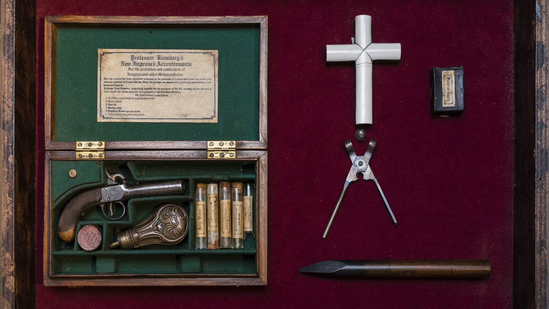 A 19th century Vampire Killing Kit which contains an ivory cross, a gun, silver bullets, a wooden stake, holy water and garlic. (Credit: Timothy Fadek/Corbis via Getty Images)