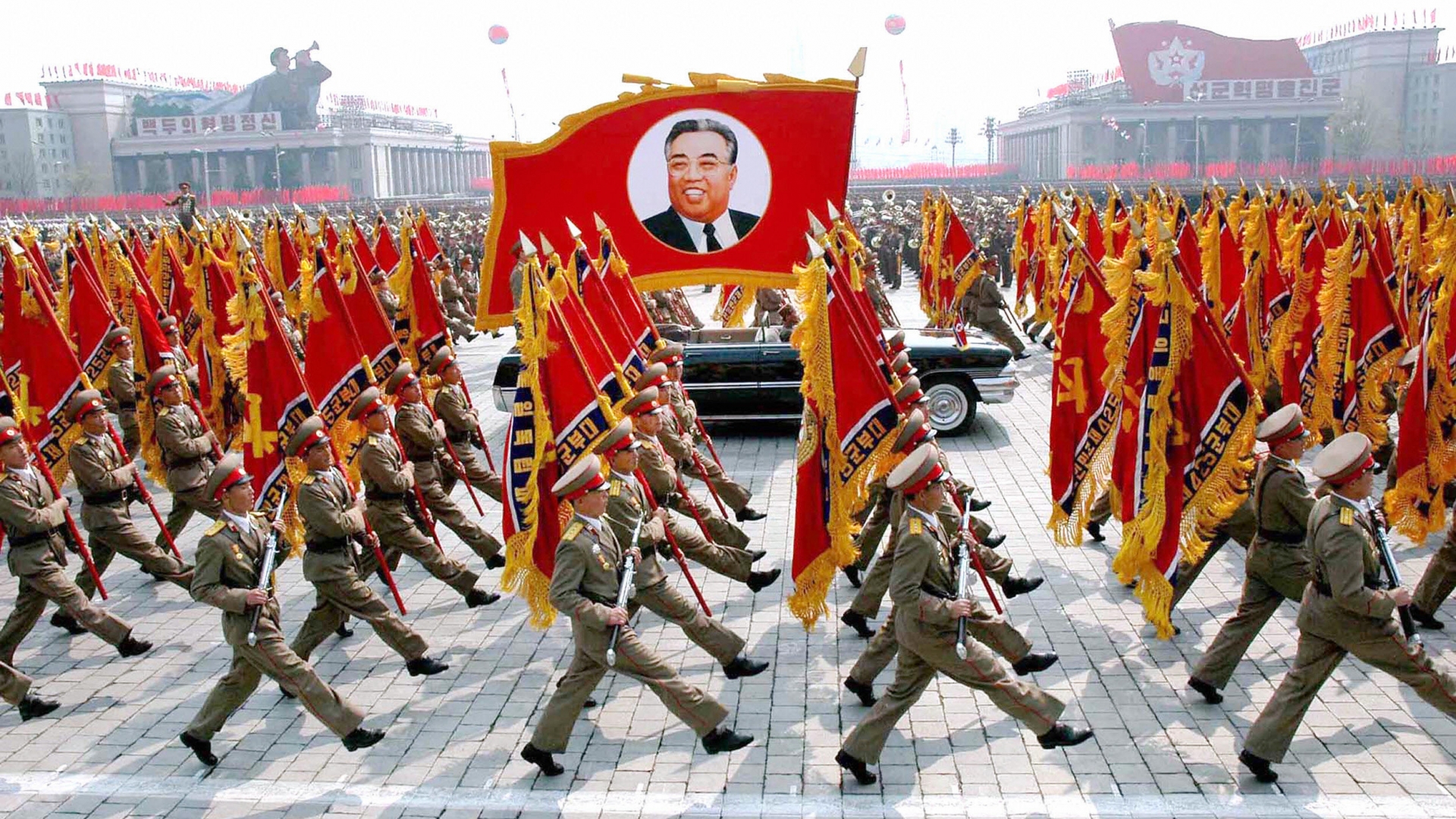 This picture, released from Korean Central News Agency in 2007, shows North Korean soldiers, carrying a large portrait of late North Korean leader Kim Il Sung during a military parade to celebrate the 75th founding anniversary of the KPA at the Kim Il Sung square in Pyongyang, North Korea. (Credit: KCNA/AFP/Getty Images)