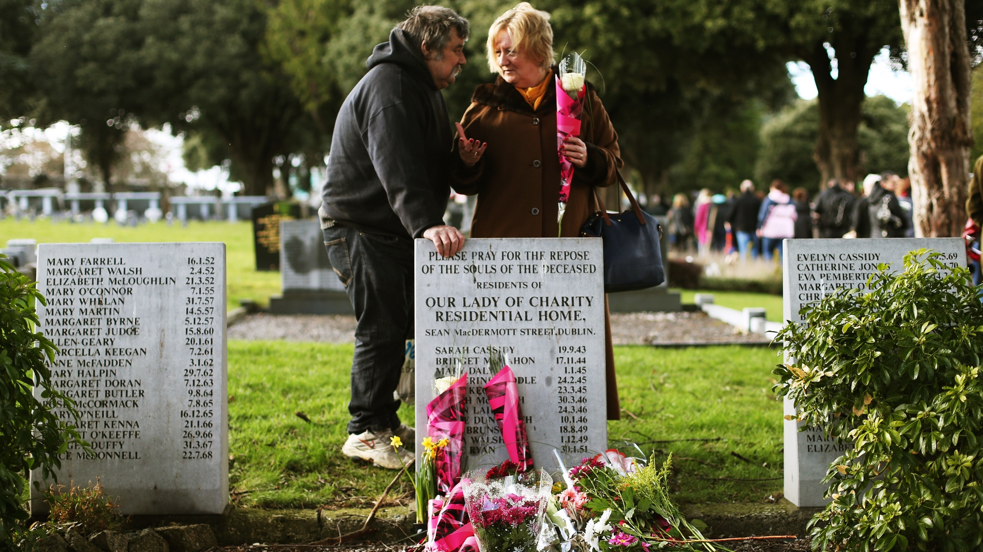 Kevin Flanagan with Marie Barry, who was born at a Bessboro Mother and Baby home, at the 2014 third annual Flowers for Magdalenes remembrance event in Glasnevin cemetery, Dublin, to mark all of the women incarcerated in the Magdalene laundries. (Credit: Brian Lawless/PA Images/Getty Images)