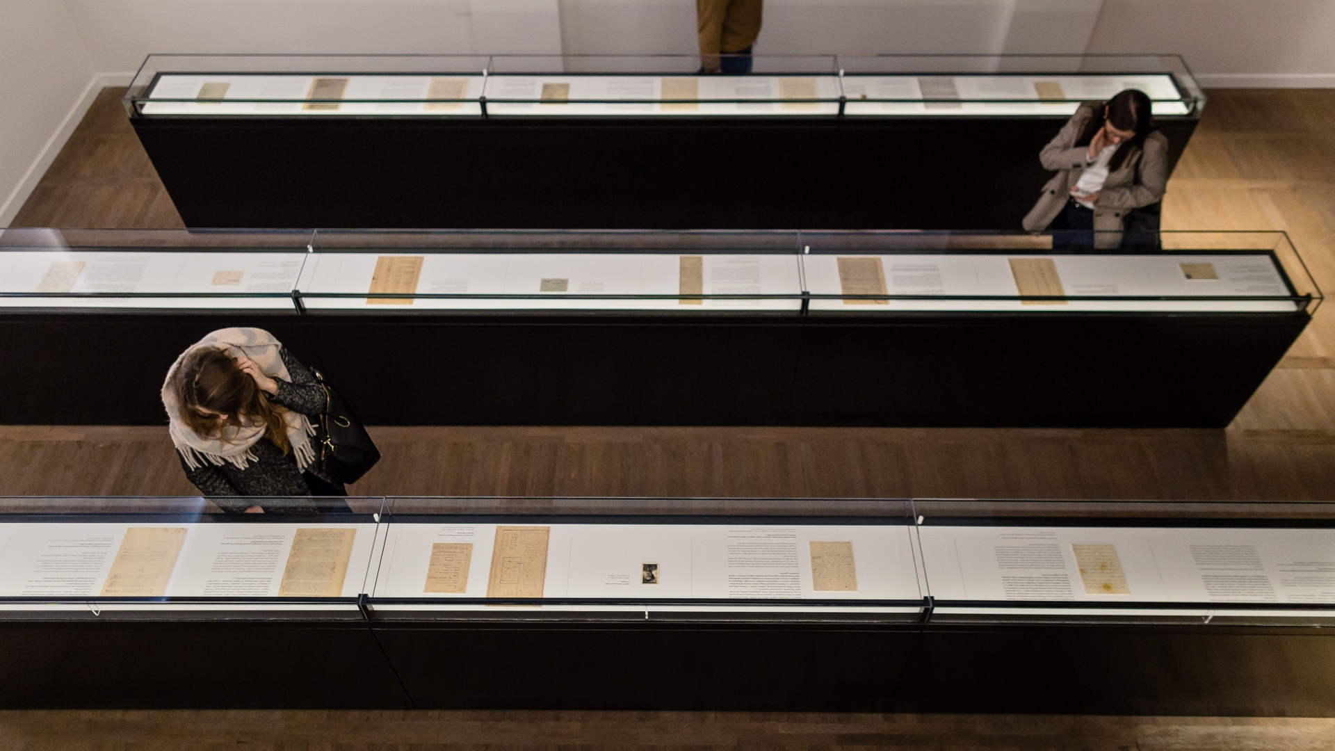People visitng the Jewish Historical Institute in Warsaw, which includes a permanent exhibition titled 'What We Were Unable To Shout Out To The World' featuring the Ringelblum Archive. (Credit: Wojtek Radwanski/AFP/Getty Images)